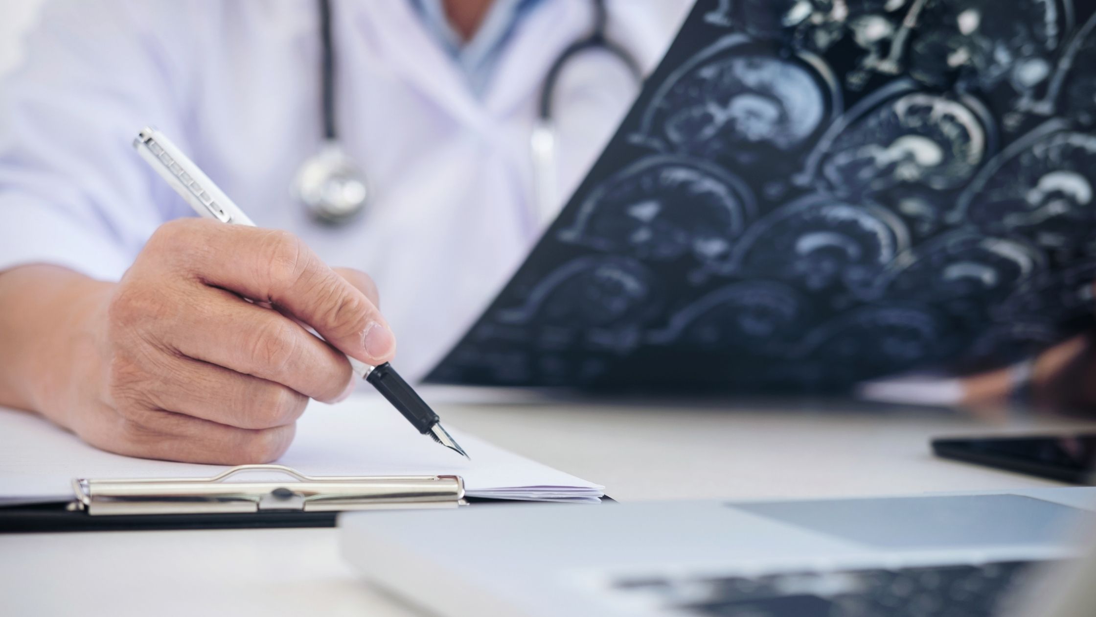 Neurologist Expert Witness Studying a Brain Scan